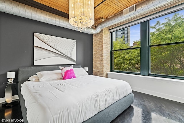 411 W Ontario St Unit 201-302, Chicago, IL 60654 - bedroom with a chandelier, wood ceiling, baseboards, and wood finished floors