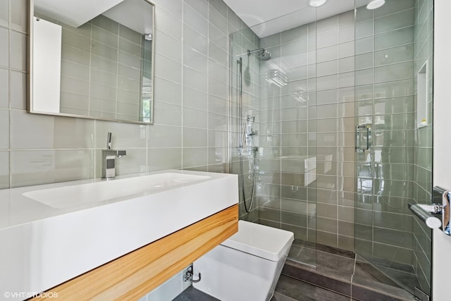 411 W Ontario St Unit 201-302, Chicago, IL 60654 - full bathroom with tile walls, walk in shower, vanity, toilet, and tasteful backsplash