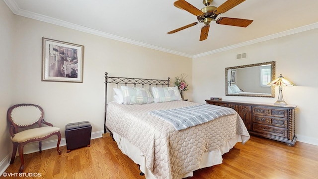 2443 Maple St, River Grove, IL 60171 - bedroom featuring ornamental molding, wood finished floors, baseboards, and ceiling fan