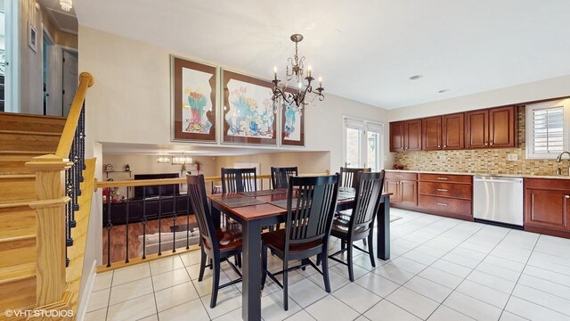 2443 Maple St, River Grove, IL 60171 - dining area featuring a chandelier, healthy amount of natural light, and light tile patterned floors