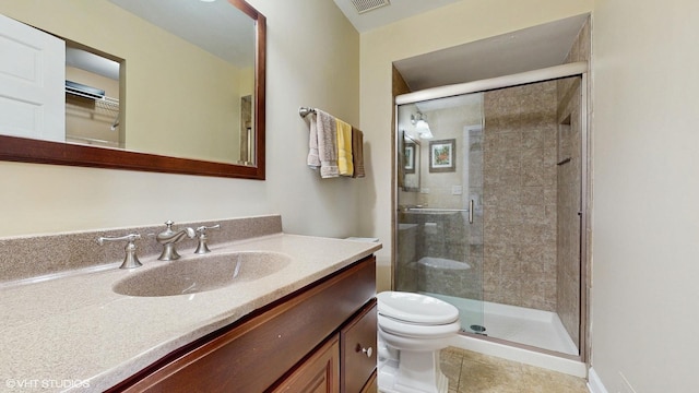 2443 Maple St, River Grove, IL 60171 - bathroom with a shower stall, vanity, toilet, and tile patterned floors