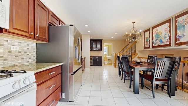 2443 Maple St, River Grove, IL 60171 - kitchen with white appliances, tasteful backsplash, a chandelier, light tile patterned floors, and recessed lighting