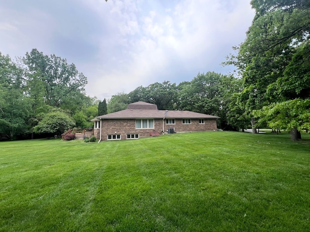 38W361 Binnie Rd, Dundee, IL 60118 - back of house with a yard, a wooden deck, and brick siding
