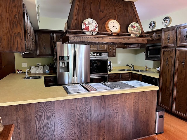 38W361 Binnie Rd, Dundee, IL 60118 - kitchen featuring black appliances, a sink, a peninsula, and dark brown cabinets