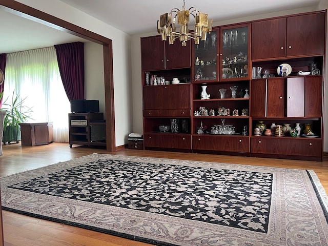 38W361 Binnie Rd, Dundee, IL 60118 - living room featuring a chandelier and light wood-type flooring