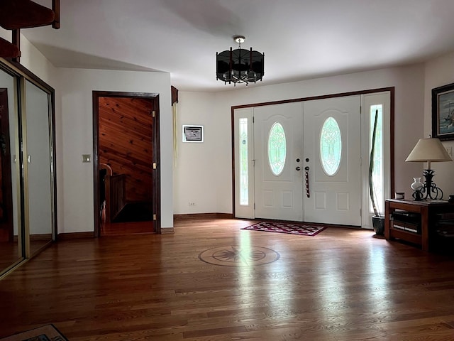 38W361 Binnie Rd, Dundee, IL 60118 - entrance foyer with healthy amount of natural light, a chandelier, wood finished floors, and baseboards