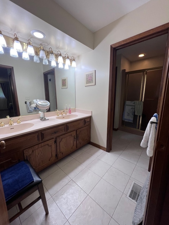 38W361 Binnie Rd, Dundee, IL 60118 - full bathroom featuring double vanity, tile patterned floors, a stall shower, and baseboards