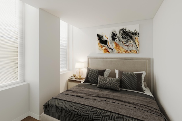 740 S Federal St Unit 301, Chicago, IL 60605 - bedroom with multiple windows, wood finished floors, and baseboards