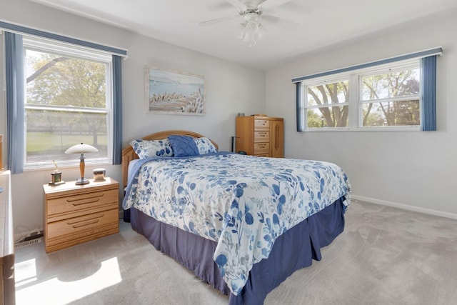 298 Fern Dr, Elk Grove Village, IL 60007 - bedroom featuring light colored carpet, multiple windows, ceiling fan, and baseboards