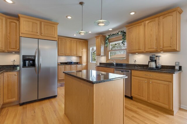 298 Fern Dr, Elk Grove Village, IL 60007 - kitchen featuring appliances with stainless steel finishes, light wood-style flooring, a kitchen island, dark stone countertops, and recessed lighting