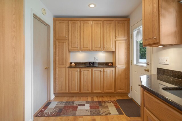 298 Fern Dr, Elk Grove Village, IL 60007 - kitchen with dark stone countertops, light wood-style flooring, and recessed lighting