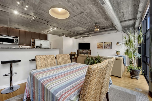 1110 W 15th St Unit 228, Chicago, IL 60608 - dining room with wood finished floors and a ceiling fan