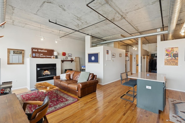 6 S Laflin St Unit 518, Chicago, IL 60607 - living room with light wood-style flooring and a warm lit fireplace