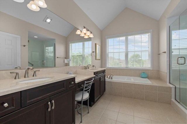 2140 Washington Dr, Northbrook, IL 60062 - full bathroom featuring vaulted ceiling, a bath, double vanity, tile patterned flooring, and a shower stall
