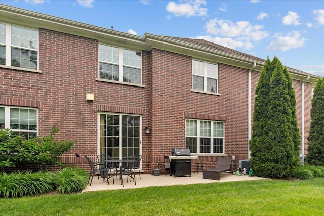 2140 Washington Dr, Northbrook, IL 60062 - back of house featuring a patio, a yard, brick siding, and cooling unit