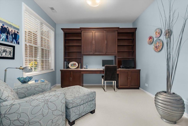 2140 Washington Dr, Northbrook, IL 60062 - home office with built in desk, light colored carpet, plenty of natural light, and baseboards