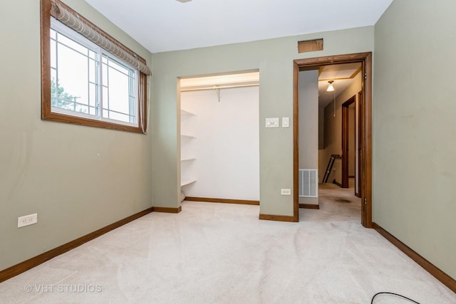 9335 Odell Ave, Bridgeview, IL 60455 - unfurnished bedroom featuring light carpet and a closet