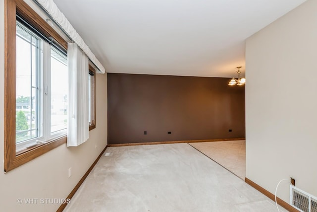 9335 Odell Ave, Bridgeview, IL 60455 - empty room with a chandelier and light carpet