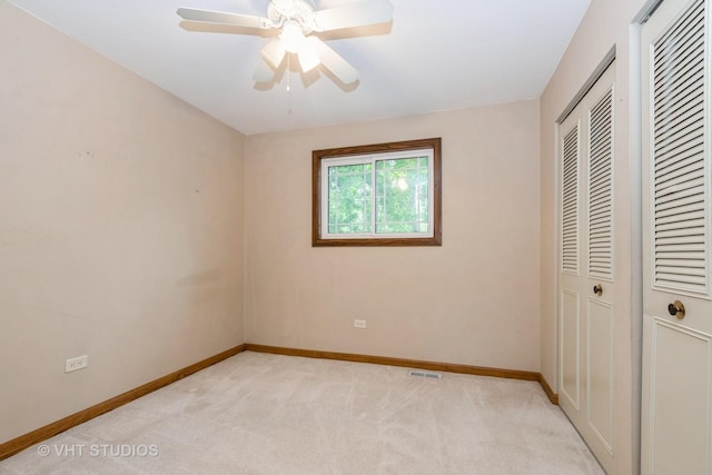 9335 Odell Ave, Bridgeview, IL 60455 - unfurnished bedroom featuring light colored carpet and a ceiling fan