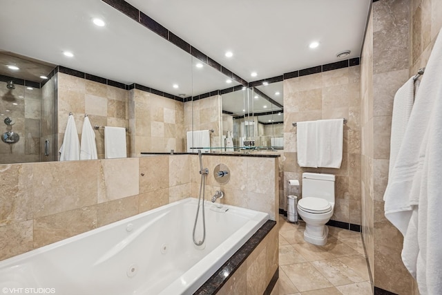 30 E Huron St Unit 3109, Chicago, IL 60611 - full bathroom with tile walls, toilet, a jetted tub, recessed lighting, and tiled shower