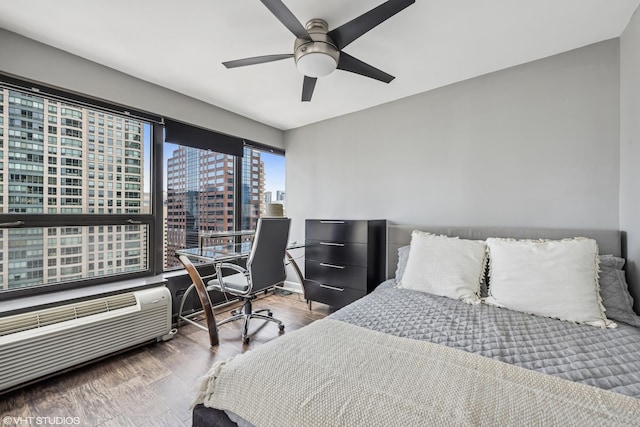 30 E Huron St Unit 3109, Chicago, IL 60611 - bedroom with a city view, wood finished floors, ceiling fan, and an office area
