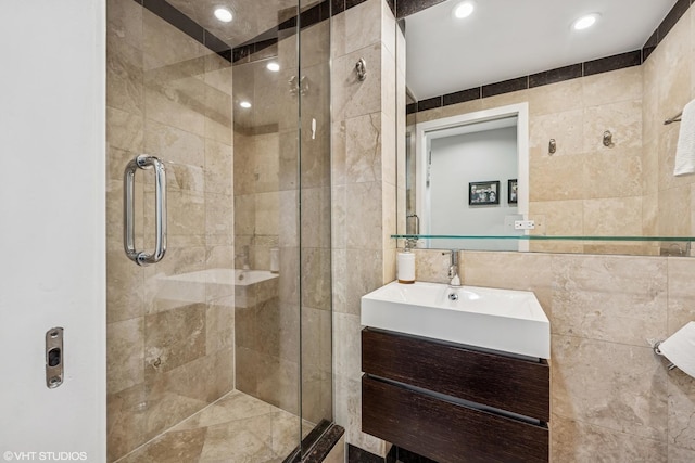 30 E Huron St Unit 3109, Chicago, IL 60611 - bathroom with tile walls, a stall shower, vanity, and recessed lighting