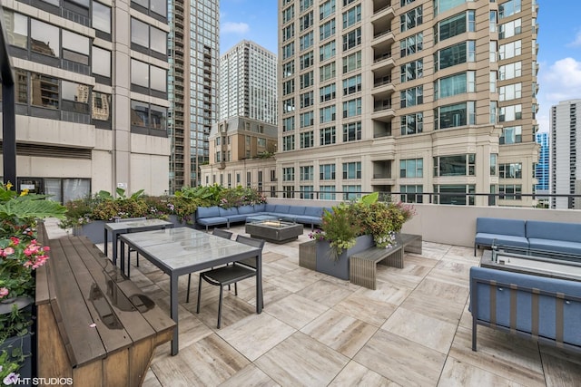 30 E Huron St Unit 3109, Chicago, IL 60611 - view of home's community with an outdoor living space with a fire pit, a city view, and a patio area