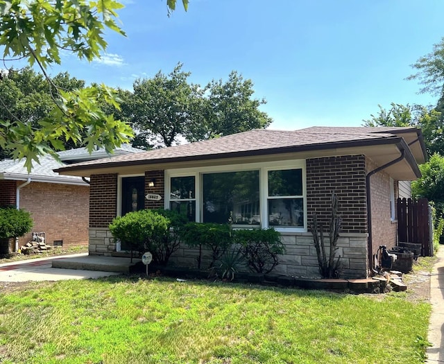 14425 Sanderson Ave, Dolton, IL 60419 - single story home with brick siding, stone siding, a front lawn, and roof with shingles