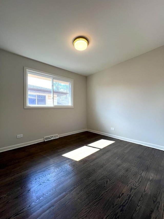14425 Sanderson Ave, Dolton, IL 60419 - spare room with dark wood-type flooring and baseboards
