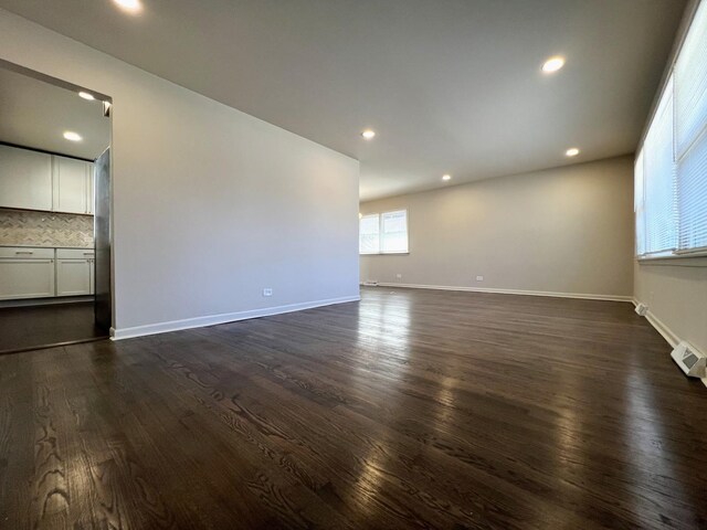 14425 Sanderson Ave, Dolton, IL 60419 - empty room with dark wood-style flooring, baseboards, and recessed lighting