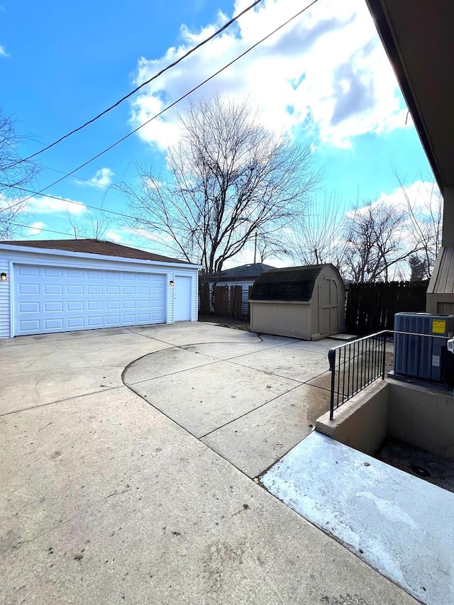 14425 Sanderson Ave, Dolton, IL 60419 - detached garage featuring central AC unit and a storage unit