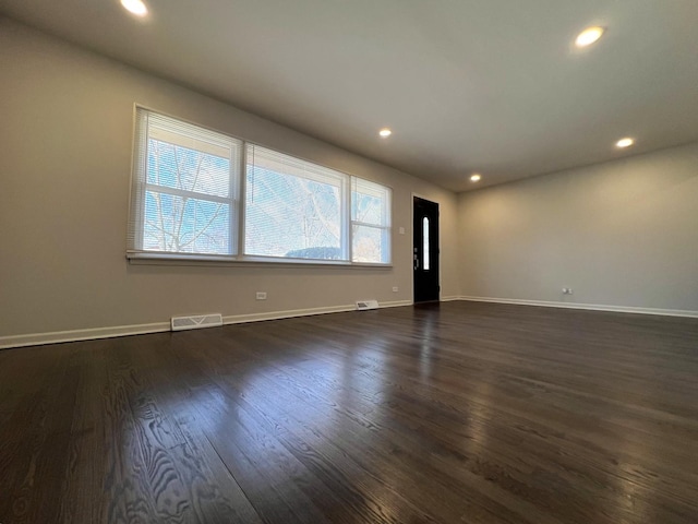14425 Sanderson Ave, Dolton, IL 60419 - spare room with dark wood-type flooring, recessed lighting, and baseboards