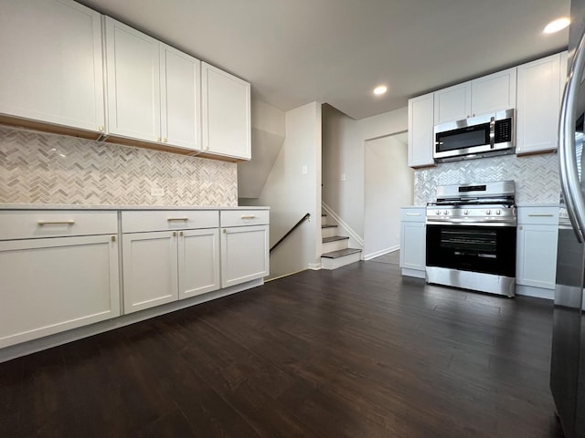 14425 Sanderson Ave, Dolton, IL 60419 - kitchen featuring appliances with stainless steel finishes, backsplash, white cabinetry, dark wood-style floors, and recessed lighting