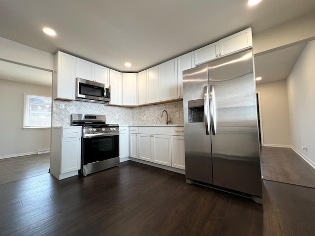 14425 Sanderson Ave, Dolton, IL 60419 - kitchen with appliances with stainless steel finishes, dark wood-style flooring, backsplash, and recessed lighting