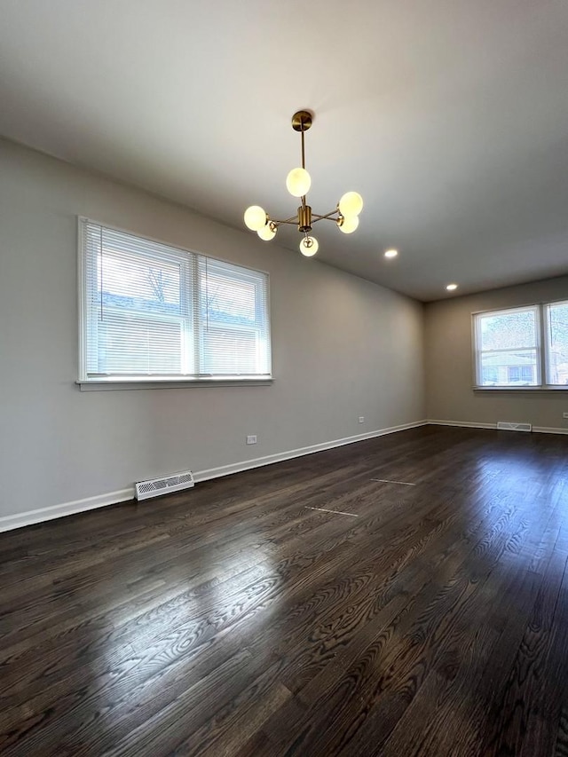 14425 Sanderson Ave, Dolton, IL 60419 - unfurnished room featuring a chandelier, dark wood finished floors, baseboards, and recessed lighting