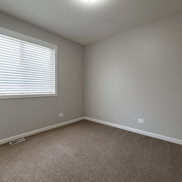 50 Oakhurst Rd, Matteson, IL 60443 - unfurnished room featuring dark carpet and baseboards