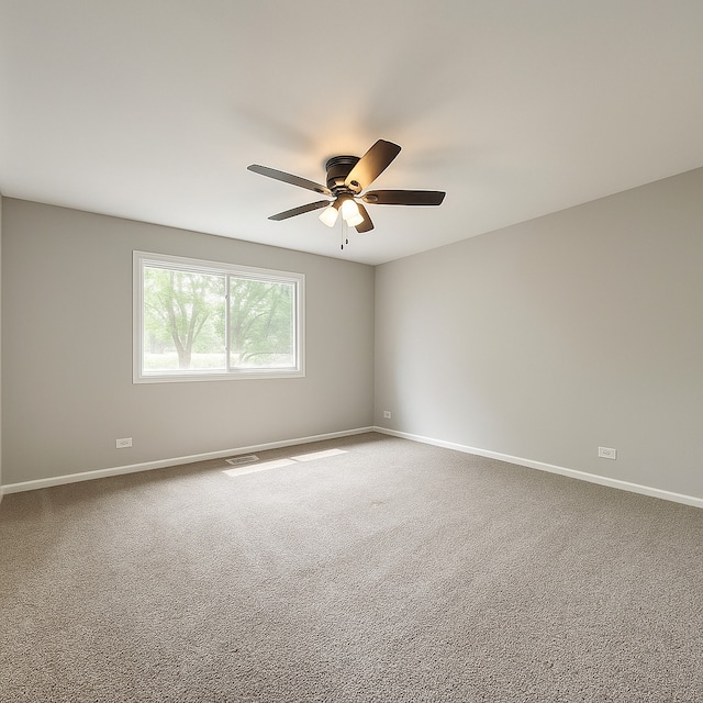 50 Oakhurst Rd, Matteson, IL 60443 - empty room featuring ceiling fan, baseboards, and carpet