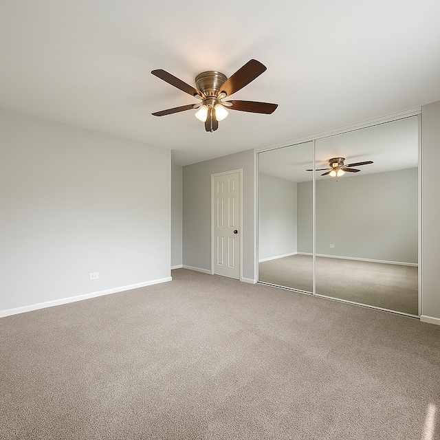 50 Oakhurst Rd, Matteson, IL 60443 - unfurnished bedroom featuring carpet, baseboards, and a ceiling fan