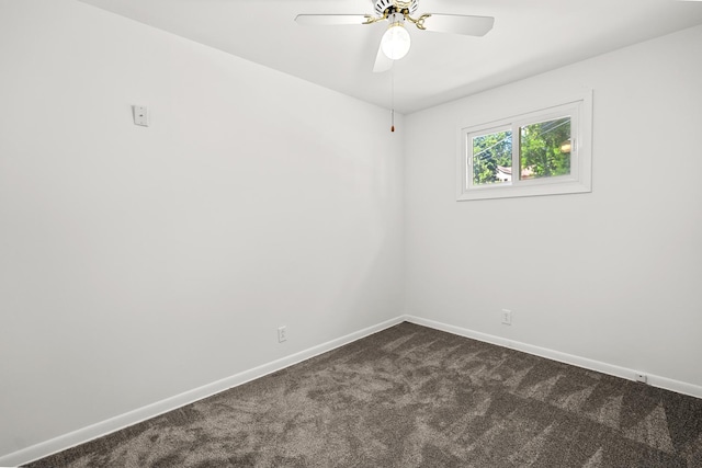 5110 W Lake Shore Dr, Wonder Lake, IL 60097 - empty room with dark colored carpet and a ceiling fan