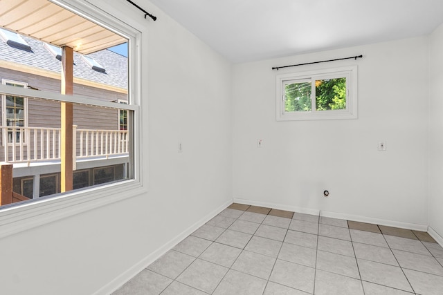 5110 W Lake Shore Dr, Wonder Lake, IL 60097 - spare room with baseboards and light tile patterned floors