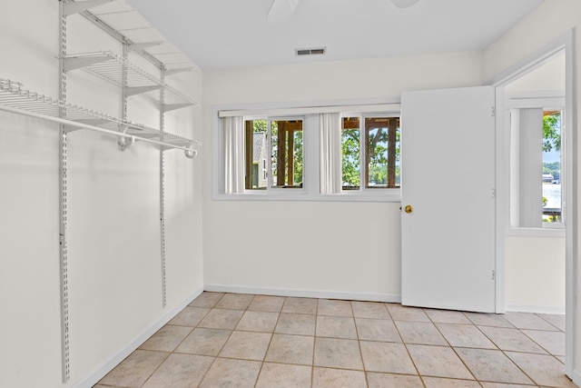 5110 W Lake Shore Dr, Wonder Lake, IL 60097 - spacious closet featuring light tile patterned floors and ceiling fan