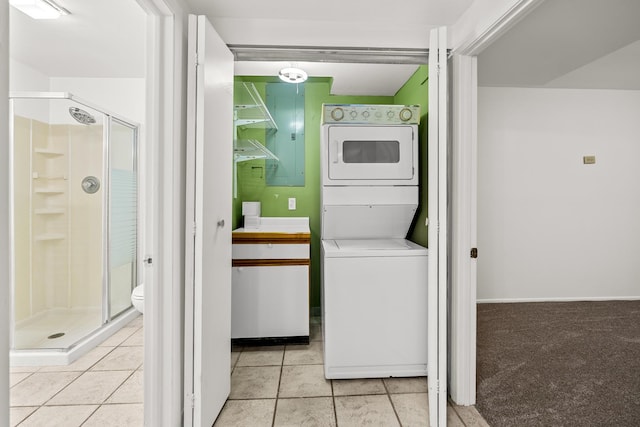 5110 W Lake Shore Dr, Wonder Lake, IL 60097 - laundry area featuring stacked washer and clothes dryer and light tile patterned floors
