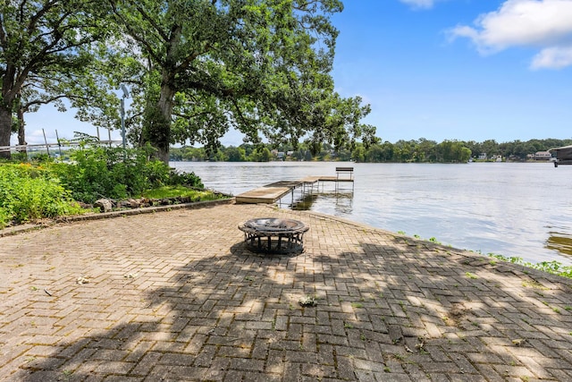 5110 W Lake Shore Dr, Wonder Lake, IL 60097 - view of patio featuring a boat dock, a fire pit, and a water view