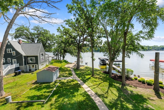 5110 W Lake Shore Dr, Wonder Lake, IL 60097 - view of grassy yard featuring a water view and a boat dock