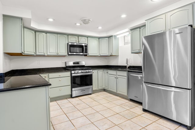 5110 W Lake Shore Dr, Wonder Lake, IL 60097 - kitchen with stainless steel appliances, green cabinets, light tile patterned flooring, and recessed lighting