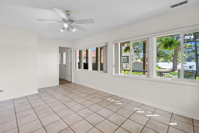 5110 W Lake Shore Dr, Wonder Lake, IL 60097 - spare room with plenty of natural light, light tile patterned flooring, and a ceiling fan