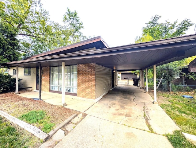 451 Tahoe St, Park Forest, IL 60466 - view of front of property featuring brick siding, an attached carport, and concrete driveway