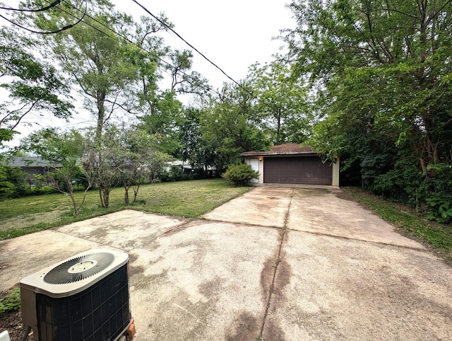 451 Tahoe St, Park Forest, IL 60466 - view of green lawn featuring central AC unit, an outdoor structure, and a garage