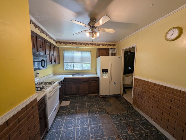 451 Tahoe St, Park Forest, IL 60466 - kitchen with white appliances, light countertops, ceiling fan, a wainscoted wall, and a sink