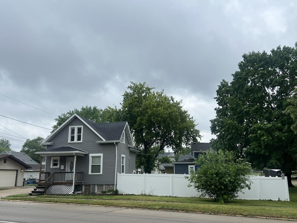 908 E 4th St, Sterling, IL 61081 - view of front of house featuring roof with shingles